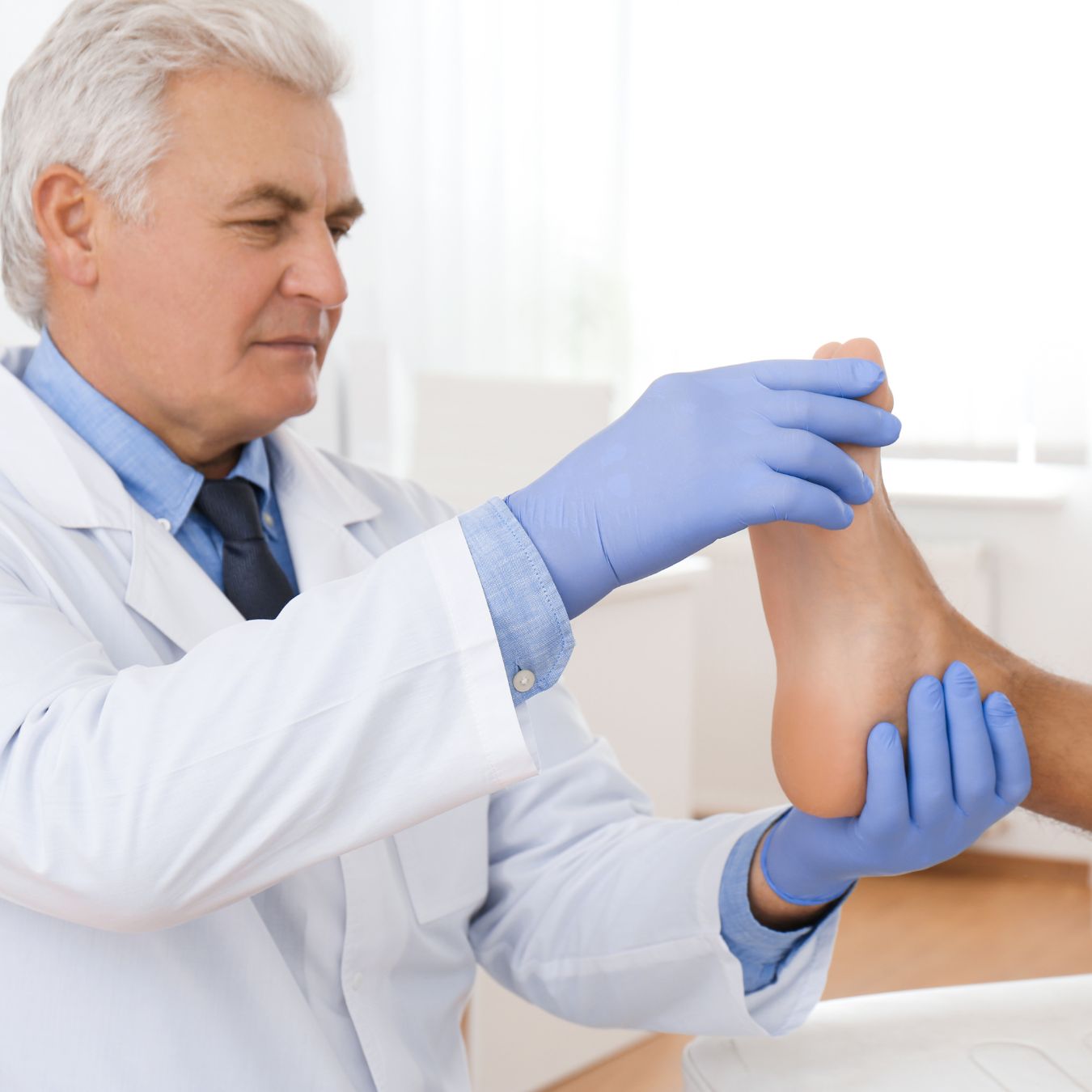 doctor assessing a patient's feet